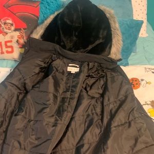 A black water resistant coat